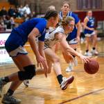 PHOTO BY FOREST WORGUM Montesanos Hazel Jones, right, reaches for a loose ball during the Bulldogs 58-39 win over Eatonville on Tuesday in Montesano.