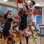 PHOTO BY FOREST WORGUM Hoquiams Chance LaBounty, right, competes for a rebound against Teninos Noah Schow (5) during a 60-54 loss on Wednesday in Hoquiam.