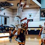PHOTO BY MATT THE PHOTOGRAPHER North Beachs Tyrell Hovland (14) dunks in a win over South Bend on Thursday in Ocean Shores.