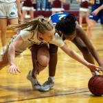 PHOTO BY FOREST WORGUM Montesanos Tieander Olson, left, and Elmas Keke Bol go for a loose ball during the Bulldogs 56-34 win on Thursday in Montesano.
