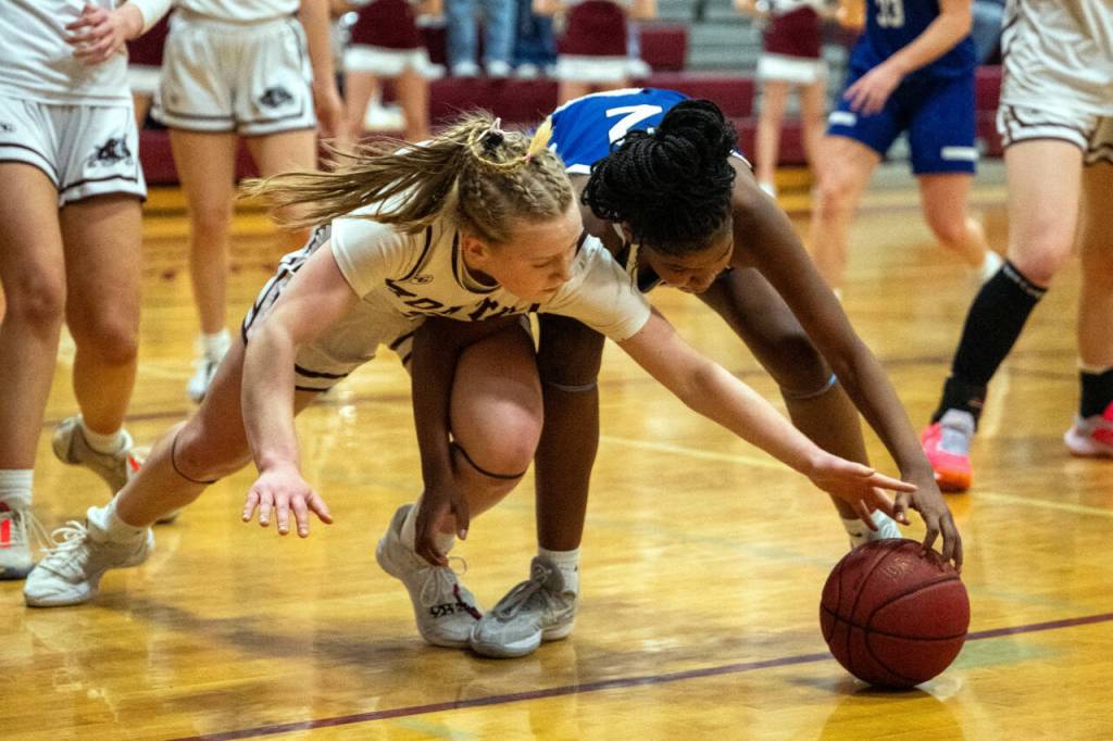 PHOTO BY FOREST WORGUM Montesanos Tieander Olson, left, and Elmas Keke Bol go for a loose ball during the Bulldogs 56-34 win on Thursday in Montesano.