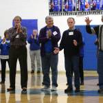 RYAN SPARKS | THE DAILY WORLD Members of Elmas 1964 state-championship team, known as the Blue Buzzsaw, are acknowledged by the crowd during a ceremony at halftime of Fridays game against Montesano.