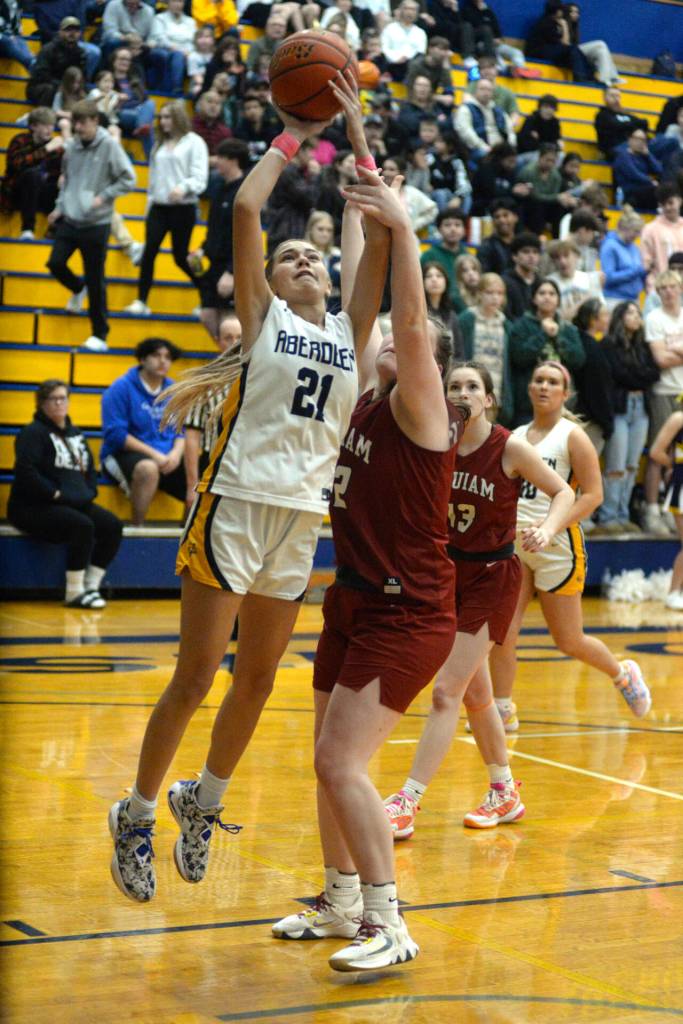RYAN SPARKS | THE DAILY WORLD Aberdeen senior forward Jaylynn Phimmasone drives to the hoop against Hoquiams Sydney Gordon during the Bobcats 55-25 win on Monday at Aberdeen High School.