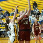 RYAN SPARKS | THE DAILY WORLD Hoquiam sophomore Sydney Gordon (42) scores against Aberdeens Bentley Brown during the Grizzlies 55-25 loss on Monday at Aberdeen High School.