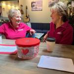 Matthew N. Wells / The Daily World
Bobbi McCracken, left, and Bette Worth, right  both of the Downtown Aberdeen Association  share a laugh at Tinderbox Coffee Roasters while they discuss what they love about Aberdeen. The topic is because the Downtown Aberdeen Association is launching a contest Thursday called Tell us … why you love Aberdeen? The point is to spread positivity about Aberdeen.