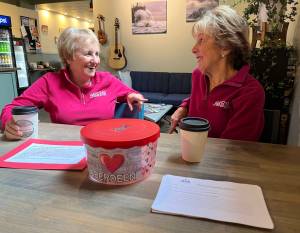 Matthew N. Wells / The Daily World
Bobbi McCracken, left, and Bette Worth, right  both of the Downtown Aberdeen Association  share a laugh at Tinderbox Coffee Roasters while they discuss what they love about Aberdeen. The topic is because the Downtown Aberdeen Association is launching a contest Thursday called Tell us … why you love Aberdeen? The point is to spread positivity about Aberdeen.