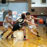 PHOTO BY FOREST WORGUM Montesanos Delon Chan, right, is defended by North Beachs Kobe Charley (20) while Montes Peyton Damasiewicz sets a screen during the Bulldogs 63-25 win on Tuesday in Montesano.