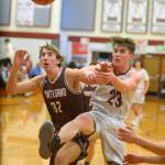 RYAN SPARKS | THE DAILY WORLD Montesano center Soren Cobb (32) and Hoquiam center Chris Bryson battle for a rebound during the Bulldogs 61-28 win on Friday in Hoquiam.