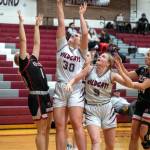 PHOTO BY FOREST WORGUM Ocosta center Alexia Bradley (30) puts up a shot while teammate Anna Davis (5) looks on during a 69-37 loss to Toledo in the first round of the 2B District 4 Tournament on Saturday in Montesano. Toledos Kailea Lairson (1) defends on the play.