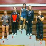 SUBMITTED PHOTO Aberdeens Peityn Munoz stands atop the podium after winning the 140-pound weight class at the WIAA District 4 Girls North 1B/2B/1A/2A Sub-Regional meet on Saturday at Hoquiam High School. Elmas Taylor Nesmith (3) and Montesanos Emma Peterson (4) are also pictured.