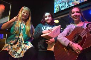 Matthew N. Wells / The Daily World
Ainsley King, from left, sets the tone for two of her fellow The Invisible Cat Band musicians, Elaine McElroy and Caelin Quinton. Zoe Quinton, who isnt a Scout, was also involved in the writing and recording process. While they recorded their first song Potato Bird, Ainsley provided direction. Despite what looks like a less than fun time with Ainsleys aggressive pointing, it was nothing less than enjoyable for all involved, including Wil Russoul, who provided the melody for the song.