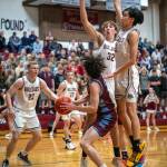 PHOTO BY FOREST WORGUM Montesanos Soren Cobb (32) and Delon Chan, right, defend against Stevensons Seth Green during the Bulldogs 75-58 win in a 1A District 4 Tournament game on Wednesday in Montesano.