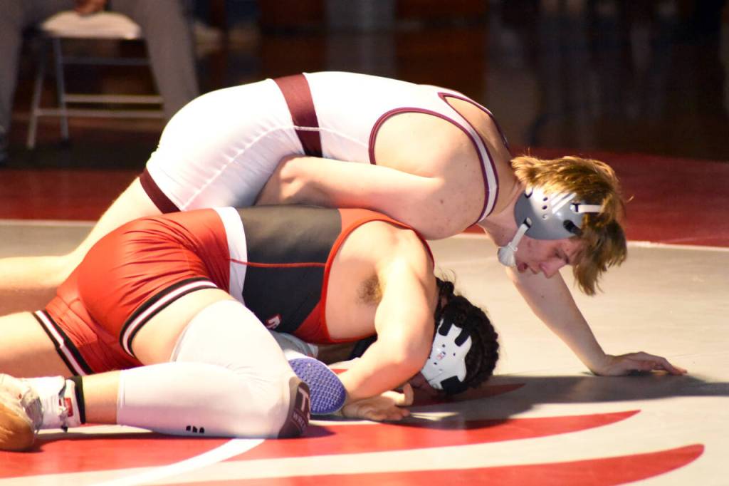 PHOTO BY SUE MICHALAK BUDSBERG Montesanos Gabe Pyhala, top, works against Teninos Koy Knox during the 175-pound final of the WIAA Region 2 Tournament on Saturday at Hoquiam High School.