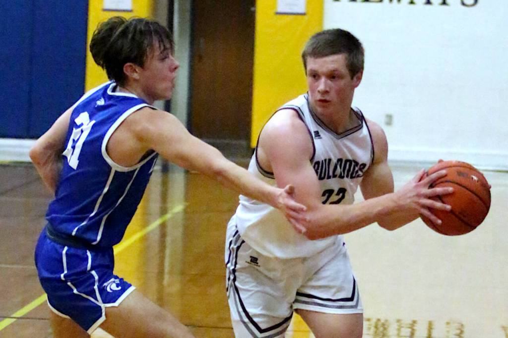 RYAN SPARKS | THE DAILY WORLD Montesano guard Peyton Damasiewicz, right, looks to pass against La Centers Jacye Grotte during the Bulldogs 70-61 victory in a 1A District 4 Tournament elimination game on Wednesday at Rochester High School.