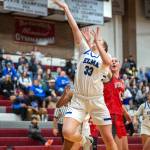 PHOTO BY FOREST WORGUM Elma sophomore forward Oliva Moore (33) scores against Castle Rocks Dakota Davis during the Eagles 42-34 win in a 1A District 4 Tournament game on Thursday at Montesano High School.