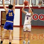 RYAN SPARKS | THE DAILY WORLD Willapa Valleys Nathan Fluke (2) shoots a three against Columbia Adventists Gareth Neufeld during the Vikings 52-44 loss in a 1B District 4 Tournament game on Thursday in Hoquiam.
