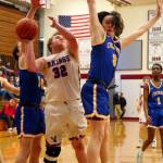 RYAN SPARKS | THE DAILY WORLD Willapa Valleys Connor Cheese Keeton (32) looks to shoot against Columbia Adventists Logan Pierce during the Vikings 52-44 loss in a 1B District 4 Tournament game on Thursday in Hoquiam.