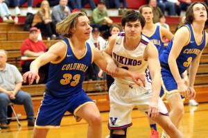 RYAN SPARKS | THE DAILY WORLD Willapa Valleys Aiden Young, right, jostles for position against Columbia Adventist Academys Tristan White during the Vikings 52-44 loss in a 1B District 4 Tournament elimination game on Thursday in Hoquiam.