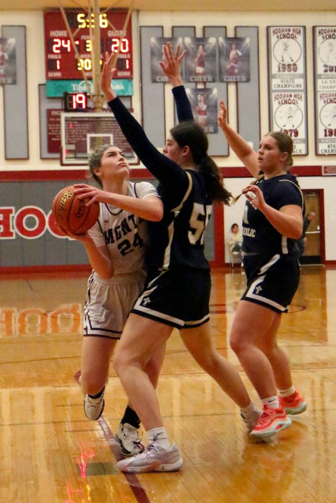 RYAN SPARKS | THE DAILY WORLD Montesanos Jillie Dalan (24) is guarded by Seton Catholics Riley Seymer (55) and Hailey Hammerstrom during the Bulldogs 41-36 victory in the 1A District 4 championship game on Saturday at Hoquiam High School.