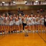 RYAN SPARKS | THE DAILY WORLD The Montesano Bulldogs pose with the 1A District 4 championship trophy after defeating Seton Catholic 41-36 on Saturday at Hoquiam High School. The Bulldogs won the title for the fourth-straight season.
