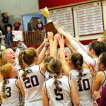 RYAN SPARKS | THE DAILY WORLD The Montesano Bulldogs hoist the 1A District 4 championship trophy after defeating Seton Catholic 41-36 on Saturday at Hoquiam High School.