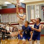 PHOTO BY FOREST WORGUM Montesano senior Tyce Peterson, top, puts up a shot against Elmas Grant Vessey (4) and Carter Studer during the Bulldogs 63-54 win in the 1A District 4 third-place game on Saturday at Hoquiam High School.