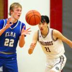 RYAN SPARKS | THE DAILY WORLD Elmas Cason Seaberg (22) receives a pass while Montesanos Delon Chan defends during the Bulldogs 63-54 win in the 1A District 4 third-place game on Saturday at Hoquiam High School.