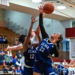 PHOTO BY FOREST WORGUM Elma senior forward Eliza Sibbett (22) and teammate Keke Bol (12) go up for a rebound during the Eagles 50-44 loss in a 1A District 4 Tournament game on Saturday at Hoquiam High School.