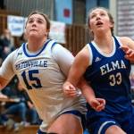 PHOTO BY FOREST WORGUM Elmas Olivia Moore (33) and Eatonvilles Sara Smith compete for a rebound during the Eagles 50-44 loss in a 1A District 4 Tournament game on Saturday at Hoquiam High School.