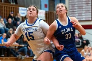 PHOTO BY FOREST WORGUM Elmas Olivia Moore (33) and Eatonvilles Sara Smith compete for a rebound during the Eagles 50-44 loss in a 1A District 4 Tournament game on Saturday at Hoquiam High School.