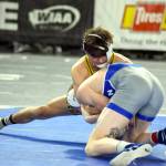 PHOTO BY SUE MICHALAK BUDSBERG Aberdeens Aidan Watkins, top, grabs hold of Pullmans Aydin Peltier in a 2A 157-pound semifinal match at the Mat Classic XXXV on Saturday at the Tacoma Dome.