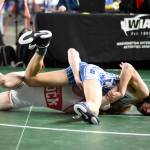 PHOTO BY SUE MICHALAK BUDSBERG Elmas Xavier Espinoza, top, grapples with Castle Rocks Skylar Ammons during the 1A 106-pound championship match at the Mat Classic XXXV on Saturday at the Tacoma Dome.