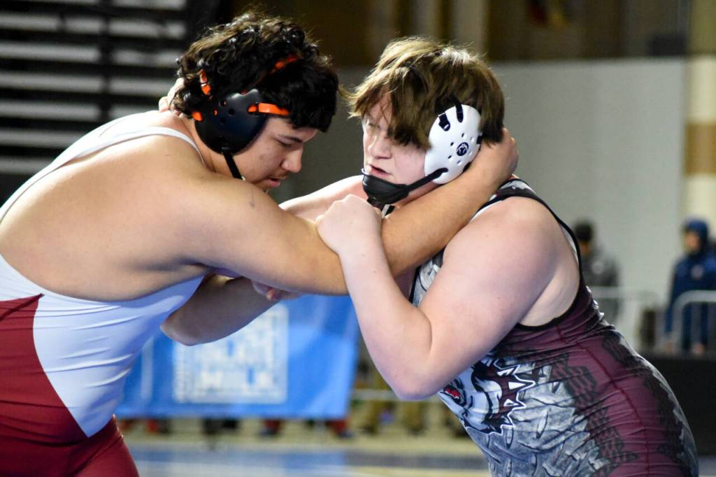 PHOTO BY SUE MICHALAK BUDSBERG Montesanos Logan Roberts, right, wrestles with Toppenishs Anthony Nava in a 1A 285-pound semifinal match at the Mat Classic XXXV on Saturday at the Tacoma Dome.