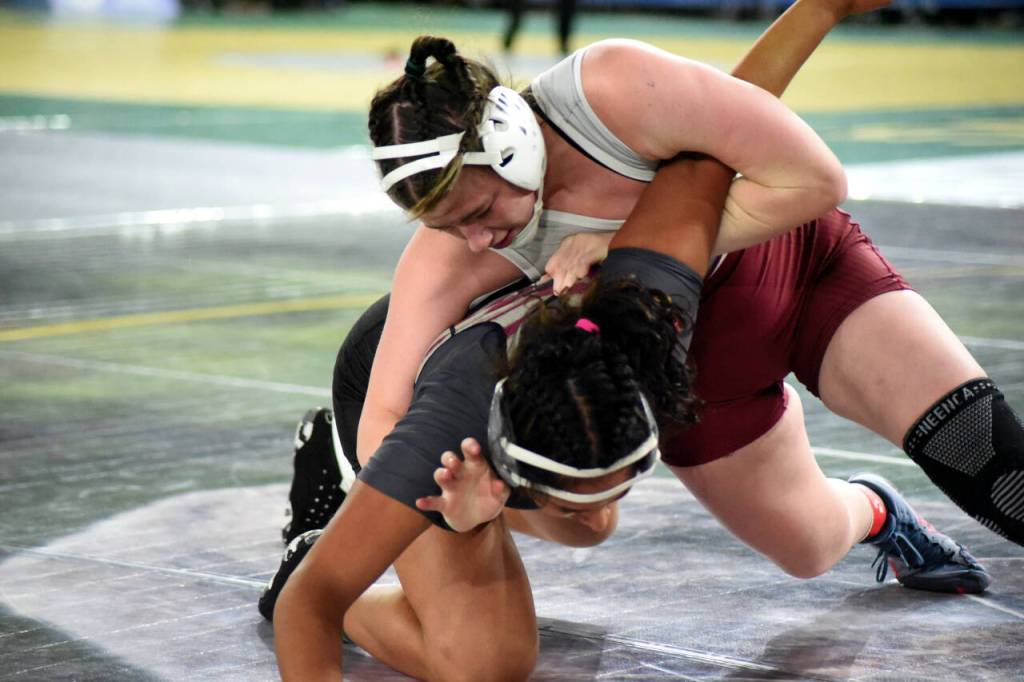 PHOTO BY SUE MICHALAK BUDSBERG Montesanos Kya Roundtree, top, controls Grandviews Ihanna Perez in a 1B/2B/1A/2A 170-pound semifinal match at the Mat Classic XXXV on Saturday at the Tacoma Dome.