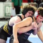 PHOTO BY SUE MICHALAK BUDSBERG North Beachs Adin Wollum, left, wrestles against Alimira Coulee Hartlines Noah Butler in a 1B/2B 215-pound semifinal match at the Mat Classic XXXV on Saturday at the Tacoma Dome.