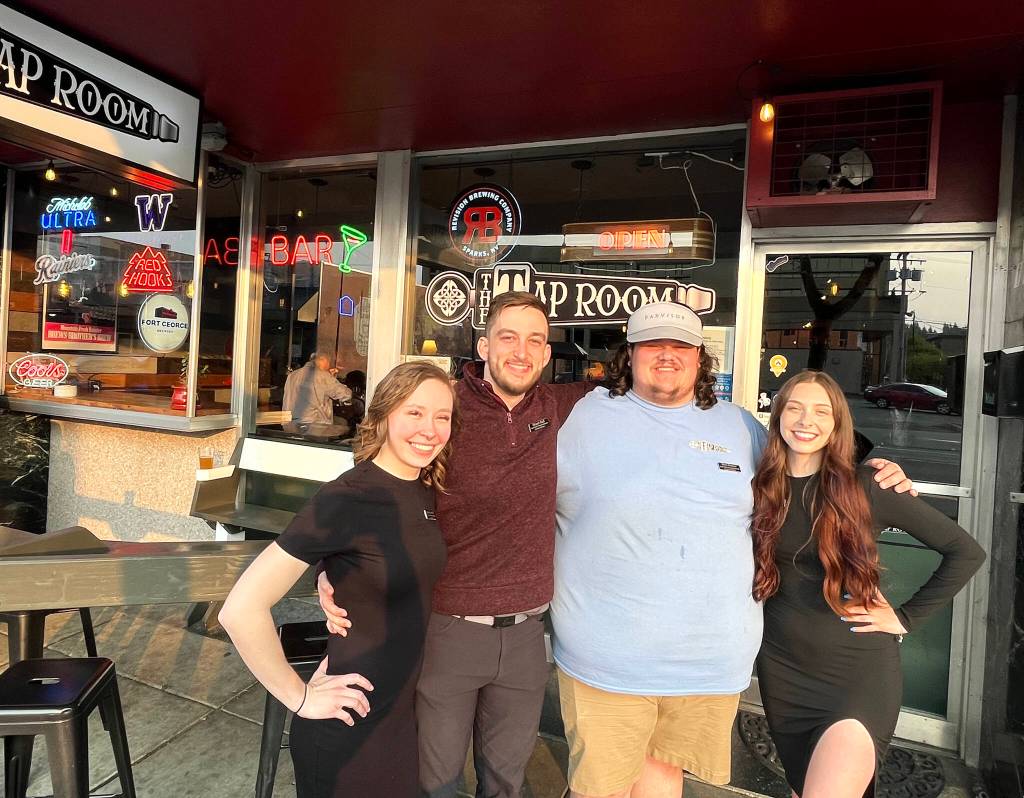 Sydney Renae Newbill, from left, Stuart Ball, Bryce Romero, and Desiree Lindgren, were all smiles May 17, 2023 in celebration of Grays Harbor Young Professionals (GHYP) not only making it to its one-year anniversary, but thriving. In addition to GHYP, in which Newbill started with Lindgren, Newbill also owns and runs her own wedding and event planning business, Renae's Rendezvous, is an Aberdeen city councilor and a part-time bartender. (Matthew N. Wells / The Daily World)