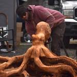 Lane Worden sculpts a wood octopus at the Ocean City Marketplace on Feb. 16. (Clayton Franke / The Daily World)