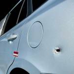 The impact from a handgun round is visible on a vehicle involved with a shooting in Aberdeen Thursday. (Michael S. Lockett / The Daily World)