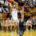 RYAN SPARKS | THE DAILY WORLD Montesano senior Gabe Bodwell (12) puts up a jump shot during the Bulldogs 69-54 loss to Sultan in a 1A State first-round game on Saturday, Feb. 24, 2024 in Tumwater.