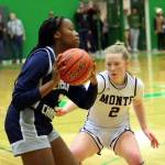 RYAN SPARKS | THE DAILY WORLD Montesano point guard Tieander Olson (2) defends Cascade Christians Emily Midimo during the Bulldogs 41-25 win in a 1A State first-round game on Satuday, Feb. 24, 2024 in Tumwater.