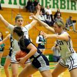 RYAN SPARKS | THE DAILY WORLD Montesanos Jillie Dalan, left, and Josie Forster, right, surround Cascade Christians Marissa Linkem during the Bulldogs 41-25 win in a 1A State first-round game on Saturday at Tumwater High School.
