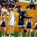 RYAN SPARKS | THE DAILY WORLD Montesanos Ali Parkin (32) puts up a shot while defended by Cascade Christians Emily Midimo during the Bulldogs 41-25 win in a 1A State first-round game on Saturday at Tumwater High School.