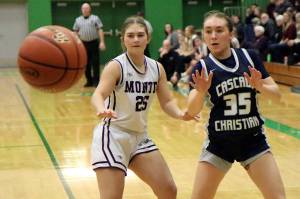 RYAN SPARKS | THE DAILY WORLD Montesanos Regan Wintrip (25) defends Cascade Christians Brooklyn Whittington during the Bulldogs 41-25 win in a 1A State first-round game on Saturday at Tumwater High School.