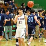 RYAN SPARKS | THE DAILY WORLD Montesano guard Delon Chan (21) tosses the ball away as the final buzzer sounds in the Bulldogs 69-54 loss to Sultan in a 1A State Tournament first-round game on Saturday at Tumwater High School.