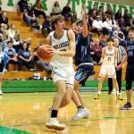 RYAN SPARKS | THE DAILY WORLD Montesano center Soren Cobb, left, looks to pass during the Bulldogs 69-54 loss to Sultan in a 1A State Tournament first-round game on Saturday at Tumwater High School.