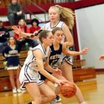 DAILY WORLD FILE PHOTO
Montesanos Lex Stanfield, left, dribbles around a screen set by teammate Izzie Taylor during a game against Seton Catholic on Feb. 17. Montesano takes on Lakeside (Nine Mile Falls) in a 1A State Round of 12 game on Wednesday in Yakima.