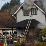 Michael S. Lockett / Daily World File
Hoquiam firefighters respond to a fire in 2023.