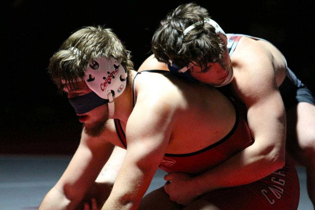 RYAN SPARKS | THE DAILY WORLD Grays Harbor College wrestler Austin Salazar, right, competes against Washington States Evann Tauscher during the 235-pound final of the NCWA Northwest Conference Championships on Saturday at Hoquiam High School.