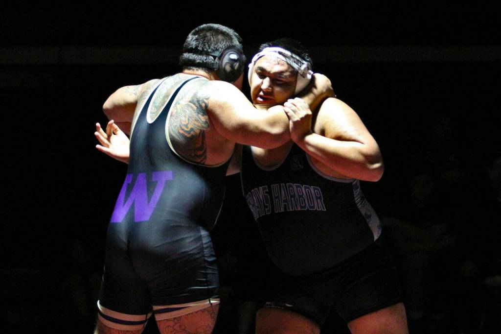 RYAN SPARKS | THE DAILY WORLD Grays Harbors Rocco Clark III, right, wrestles against University of Washingtons Keegan Bach during the 285-pound final of the NCWA Northwest Conference Championships on Saturday at Hoquiam High School.