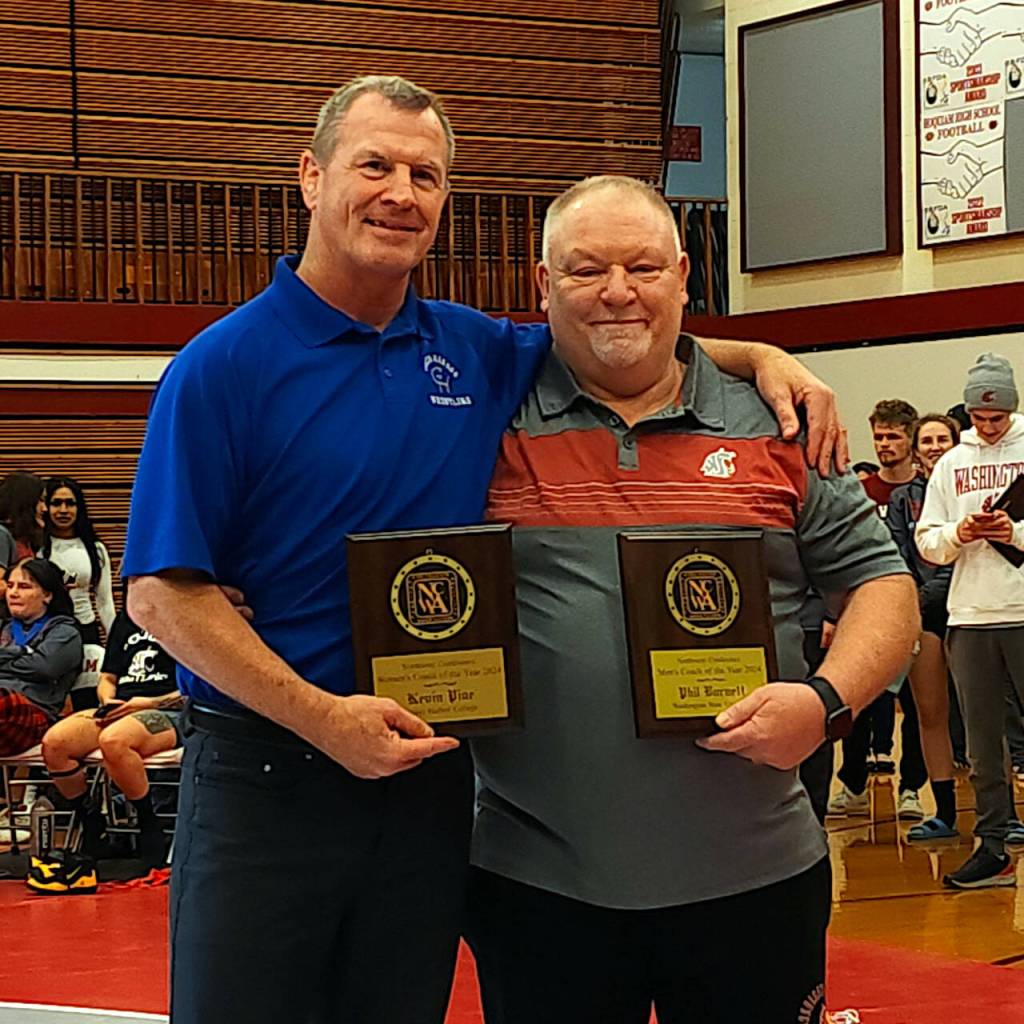 RYAN SPARKS | THE DAILY WORLD Grays Harbor Colleges Kevin Pine, left, and Washington States Phil Burnett were named the NWAC Northwest Conference womens and mens wrestling Coaches of the Year, respectively, on Saturday in Hoquiam.